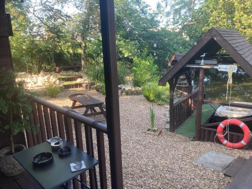 a view of a backyard with a gazebo at The Spinney lodge in Bubbenhall