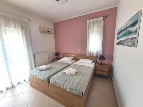 Ένα ή περισσότερα κρεβάτια σε δωμάτιο στο Elia Mare Apartment