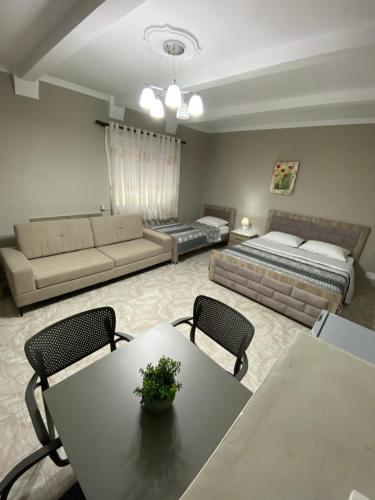 a large living room with a couch and a table at Vila Ajdinaj in Berat