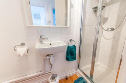 a bathroom with a sink and a shower at Seaview Oasis - Margate Abode - Sleeps 4 in Kent