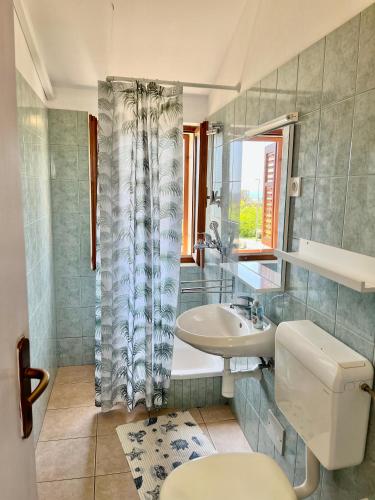 a bathroom with a toilet and a sink at Anka in Nerezine