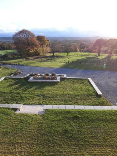 an aerial view of a park with a pond at Gite TY KERMORZU in Saint-Adrien