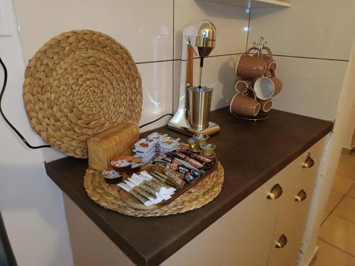 a counter with a basket of food on it at Studio 'Katerina by the Sea' in Salamina