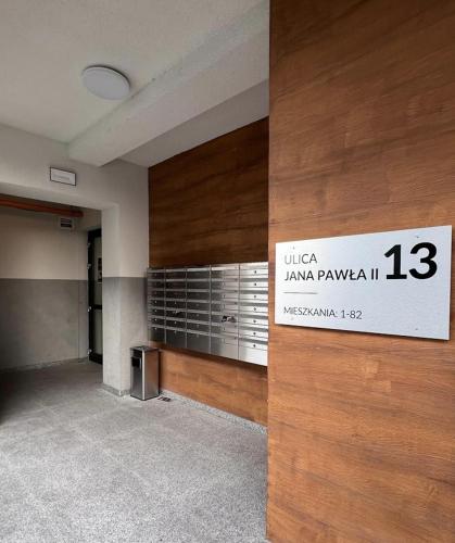 an empty room with a sign on a wall at EXCLUSIVE APARTMENTS ZATOR in Zator