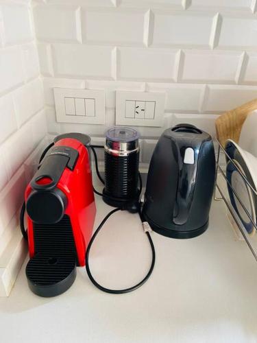 a kitchen counter with a toaster and a toaster and a toaster at Depto de lujo con pileta en San Telmo in Buenos Aires