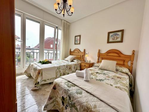 a bedroom with two beds and a window at Isla Mar - 5833 in Isla