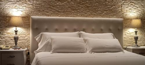 Ein Bett oder Betten in einem Zimmer der Unterkunft Hotel Palladium