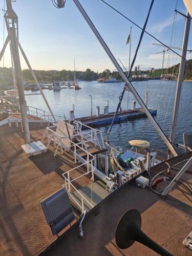 a boat docked at a dock in the water at Ship Windö in Södertälje