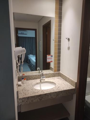 Ένα μπάνιο στο Apartamento em Olímpia/SP