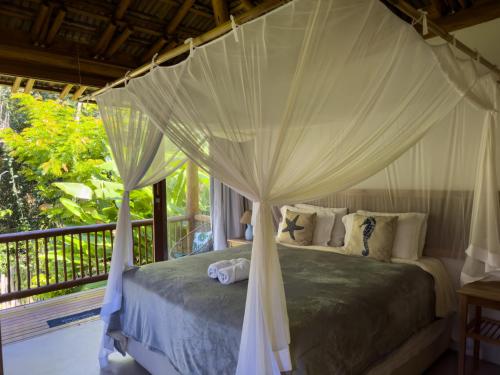 Postel nebo postele na pokoji v ubytování Boate, Beach Tennis & bangalôs STAFF Completo