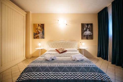 Ένα ή περισσότερα κρεβάτια σε δωμάτιο στο Taormina Lux & Elite Apartments - Taormina Holidays