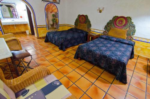 Säng eller sängar i ett rum på Hotel el Fuerte
