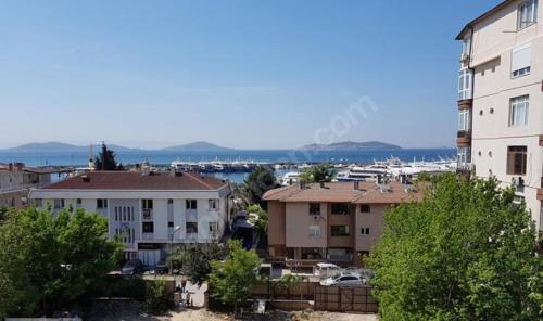 a view of a city with buildings and a harbor at Bostanci cozy excellent location flat in Istanbul