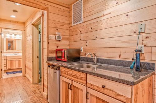 a kitchen with a sink and a microwave at Crane - Unit 6 in Bend