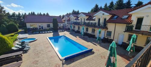 an overhead view of a swimming pool in a house at Dworek Jonatan in Chłopy