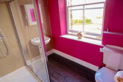 a bathroom with a toilet and a sink and a window at Greendale Teahouse and Rooms in Chatburn