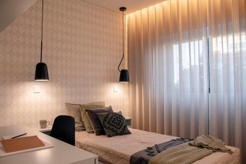 En eller flere senger på et rom på Turportugal - Villa Gafanha