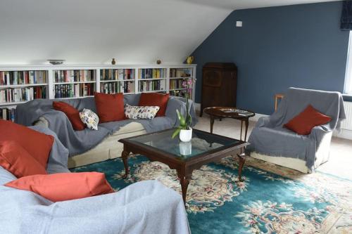 a living room with two couches and a coffee table at Cotswold dog-friendly holiday home in Stroud