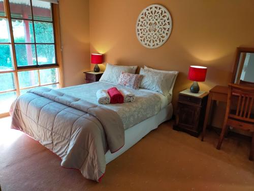 A bed or beds in a room at Dunstans Guest House