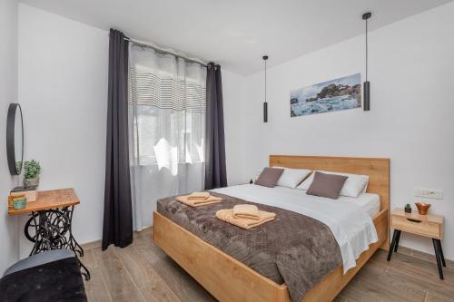 Katil atau katil-katil dalam bilik di Apartment Holiday home DoMa, Čilipi near Dubrovnik