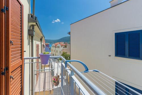 a balcony with a potted plant on it at Apartman Bruna in Cres