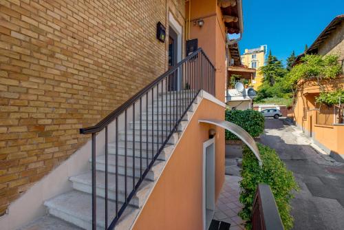 a staircase leading up to a brick building at Apartments Madeleine in Rijeka