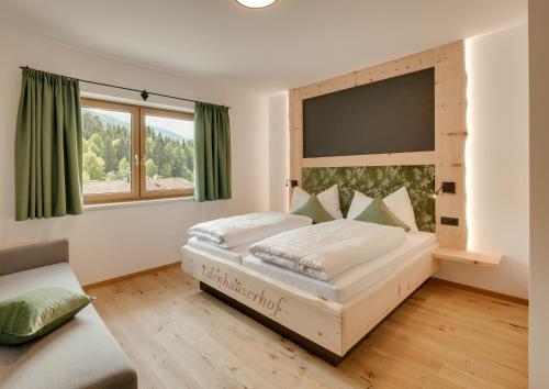 Uma cama ou camas num quarto em Edenhauserhof