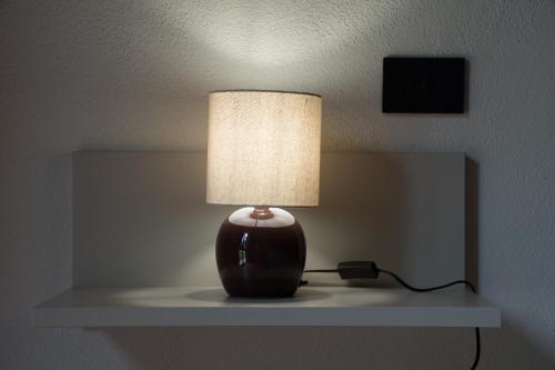 a lamp sitting on a shelf in a room at B&B La Manica in Milazzo