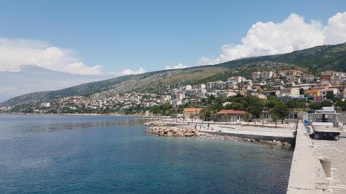 a body of water with a town on a hill at Apartment Alea in Senj
