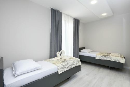 Postel nebo postele na pokoji v ubytování Sunny Day Luxury Holiday Apartments