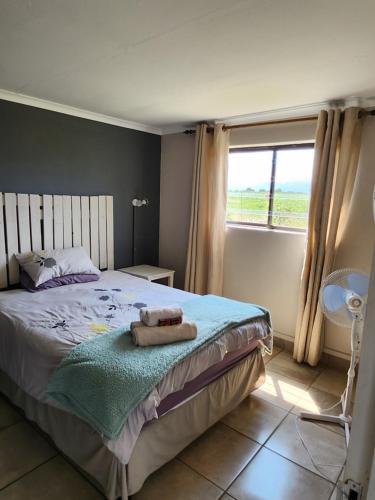 Postel nebo postele na pokoji v ubytování Sunshine Cottage