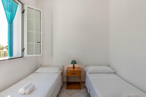 Postel nebo postele na pokoji v ubytování BED BIANCANEVE Villa
