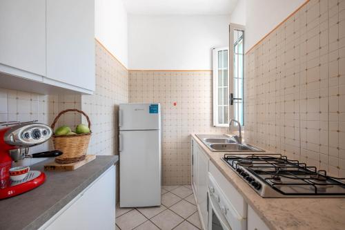Kuchyň nebo kuchyňský kout v ubytování BED BIANCANEVE Villa