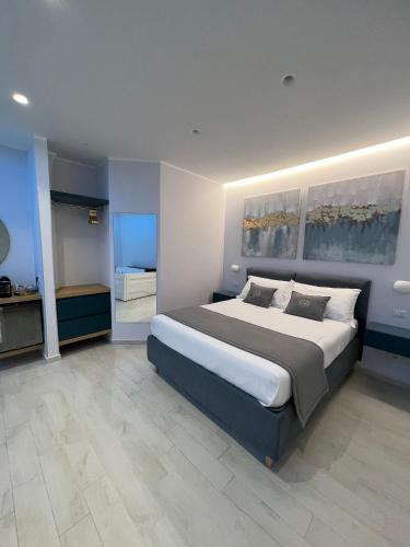 a large bedroom with a large bed in it at Naxos Marina Bay in Giardini Naxos