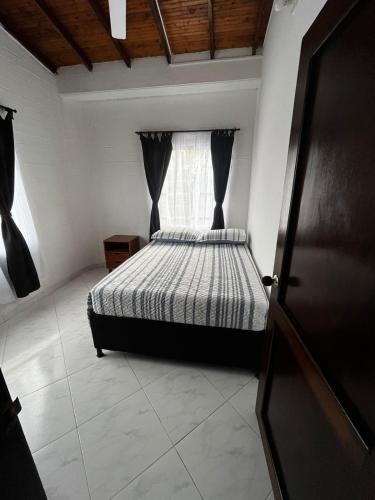 Ein Bett oder Betten in einem Zimmer der Unterkunft Acogedor y elegante apartamento en Apartadó