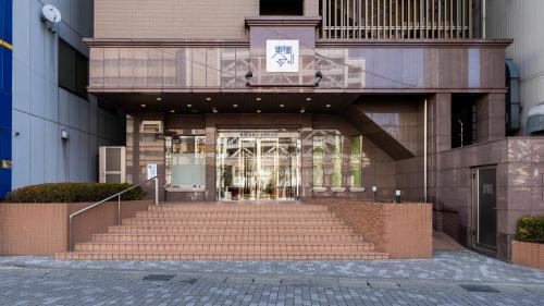 a building with stairs in front of a building at Toyoko Inn Matsumoto Ekimae Hommachi in Matsumoto