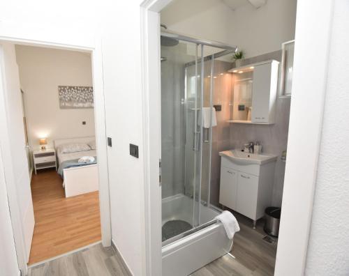 a bathroom with a shower and a sink at Apartments Zorana in Rogoznica