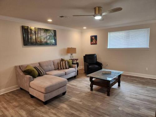 a living room with a couch and a coffee table at Maison Franklin in New Orleans