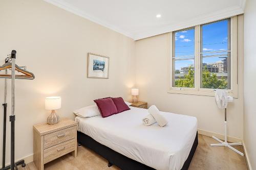 a bedroom with a bed and a window at Chelsea Terrace in Newcastle
