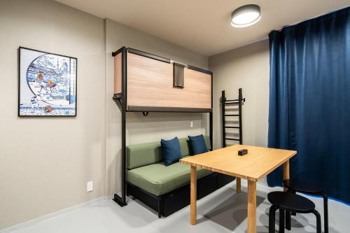 Postel nebo postele na pokoji v ubytování Section L Kuramae - Asakusa
