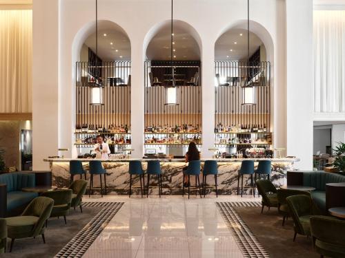 a rendering of a bar in a hotel lobby at Swissotel Sydney in Sydney