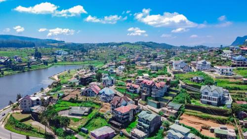 an aerial view of a residential neighbourhood next to a river at Baron Luxury Boutique in Nuwara Eliya