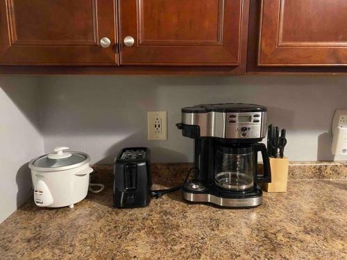 a coffee maker and a toaster on a kitchen counter at Fantastic Oasis Home in Stevens Point in Stevens Point