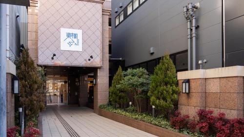 a walkway in a building with a sign on it at Toyoko Inn Shizuoka Fujieda eki Kita guchi in Fujieda
