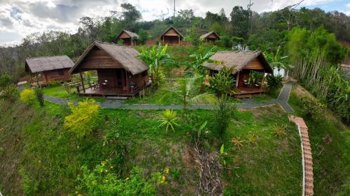 an overhead view of a group of huts on a hill at Naga Lodge in Luang Prabang
