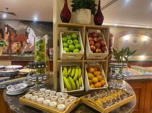 a display of fruits and vegetables on a counter at Holiday Inn Al Khobar by IHG in Al Khobar