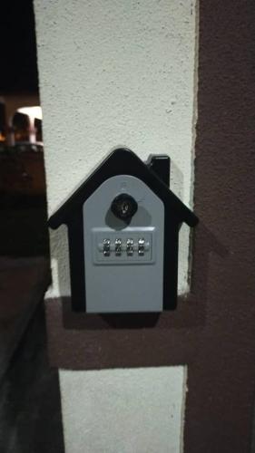 a black and white electrical outlet on a wall at Homestay Haji Din Tronoh Perak in Teronoh