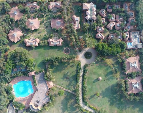 an aerial view of a resort with a pool at Vijayshree Resort, Hampi in Hampi