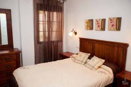 เตียงในห้องที่ Alojamiento Nohal
