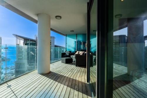 a balcony of a building with a view of the city at Seaside Serenity Oasis - High floor - Stunning Views - 1BR in Gibraltar
